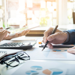 Business-man-financial-inspector-and-secretary-making-report-calculating-or-checking-balance-internal-revenue-service-inspector-checking-document-audit-concept
